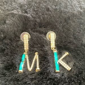 Micheal Kors pretty initial earrings .
